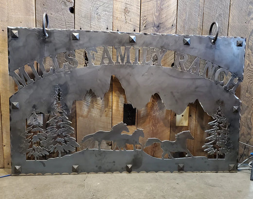Custom iron sign featuring "MILES FAMILY RANCH" with horses and trees in a rustic design
