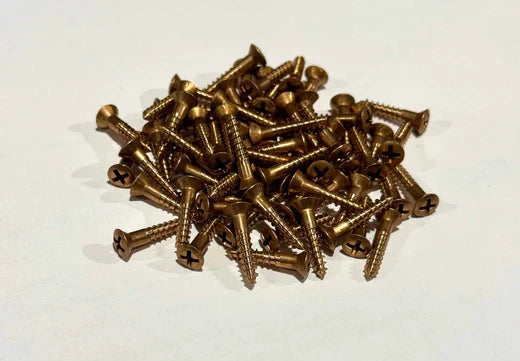 Pile of bronze screws, essential fasteners for various DIY and construction projects