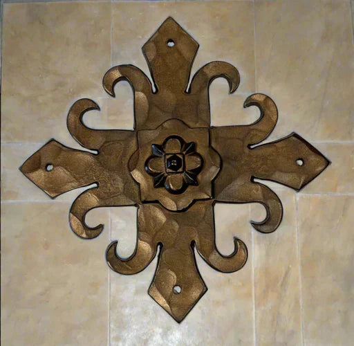 Decorative custom ironwork with floral design and intricate textures in a warm finish