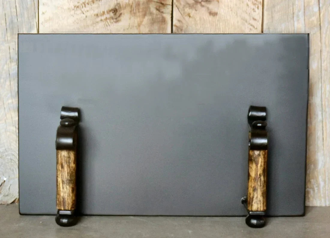 Rustic black storm door with wooden handles for outdoor pizza ovens by Old West Iron