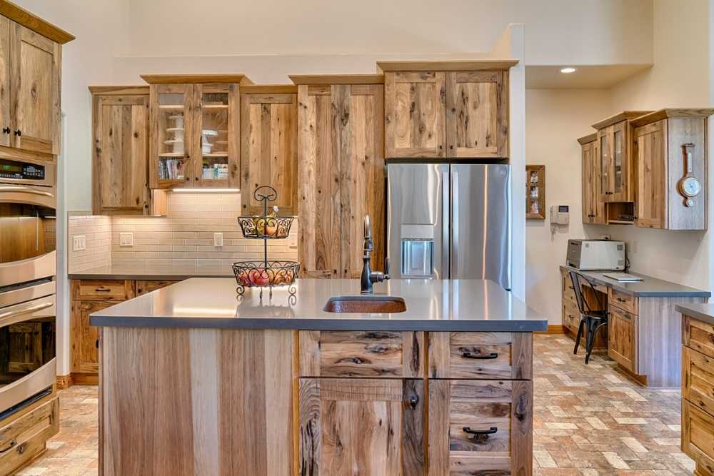 Stylish wooden kitchen cabinets with modern handles and stainless steel appliances