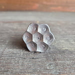 A 3/4 inch diameter flower head bolt with a raw metal finish, sitting on a wooden surface.