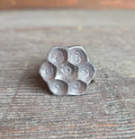 flower head lag in raw/unfinished on. wooden surface