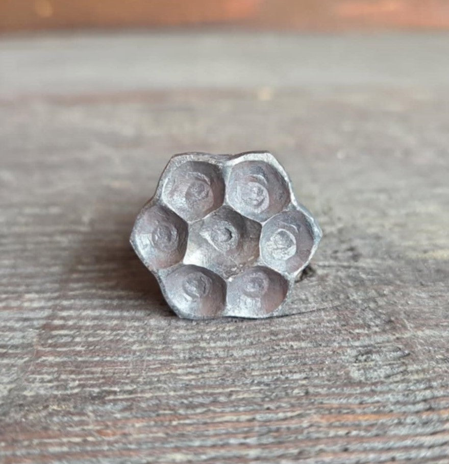 flower head lag in raw/unfinished on. wooden surface