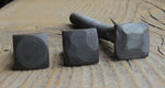 A look at 3 different textured square head bolts Smooth, Hammered, and Pyramid all are painted black on a wood background.