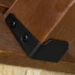Close-up of a wooden surface with a black metal bracket attached, this is a wood construction tie, can be used as deck joist