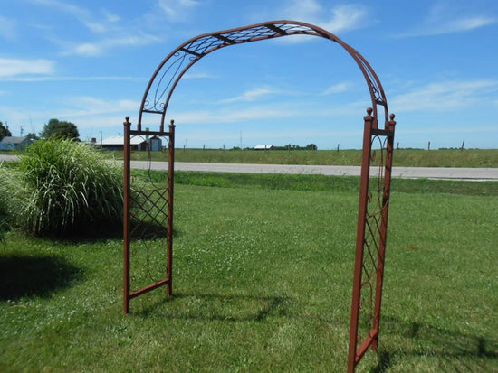 Rustic iron arbor design, ideal for outdoor spaces and enhancing natural surroundings