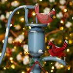 Old Style Water Pump with "Merry Christmas" Sign and Cardinals Holiday Ornaments Christmas
