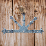 Placa central de hierro con flor de lis de Babilonia