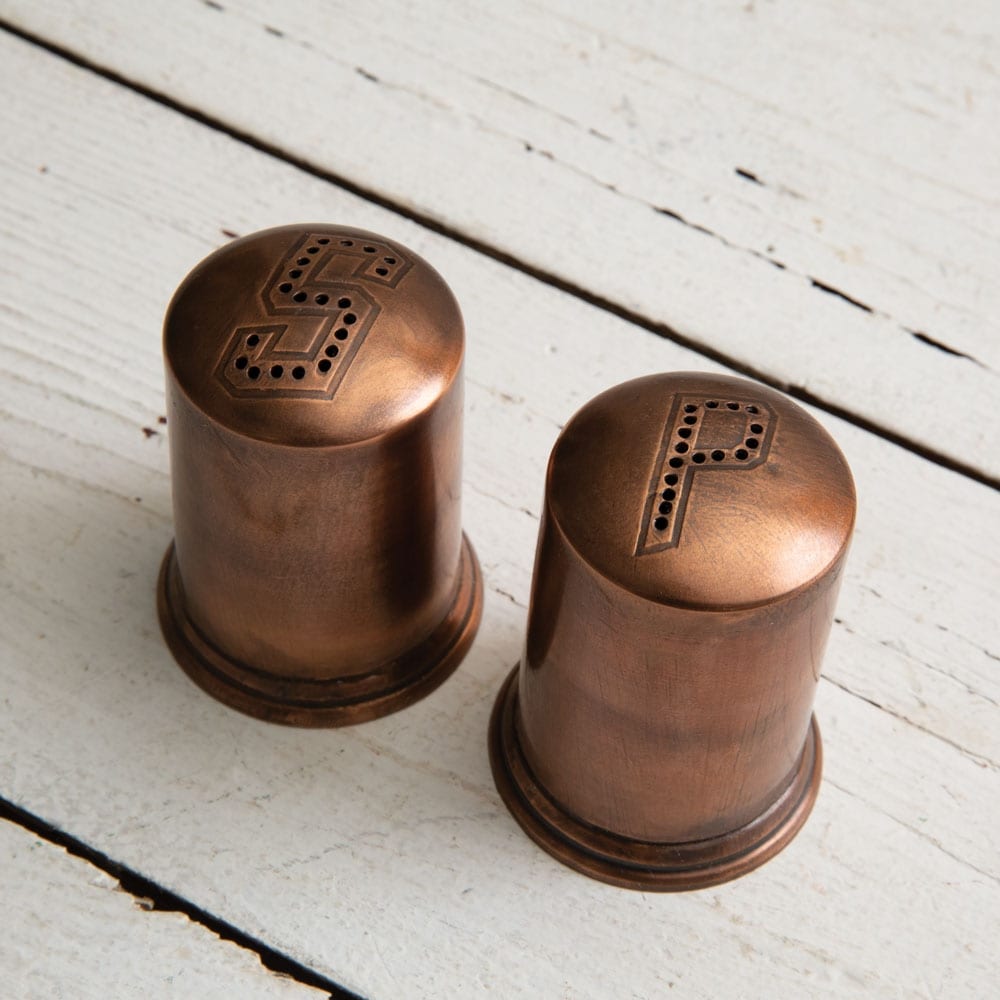 https://www.oldwestiron.com/cdn/shop/products/Copper-Finish-Salt-and-Pepper-Shakers_1024x.jpg?v=1635571785