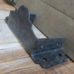 aged hammered old looking metal joist hanger on rustic barnwood