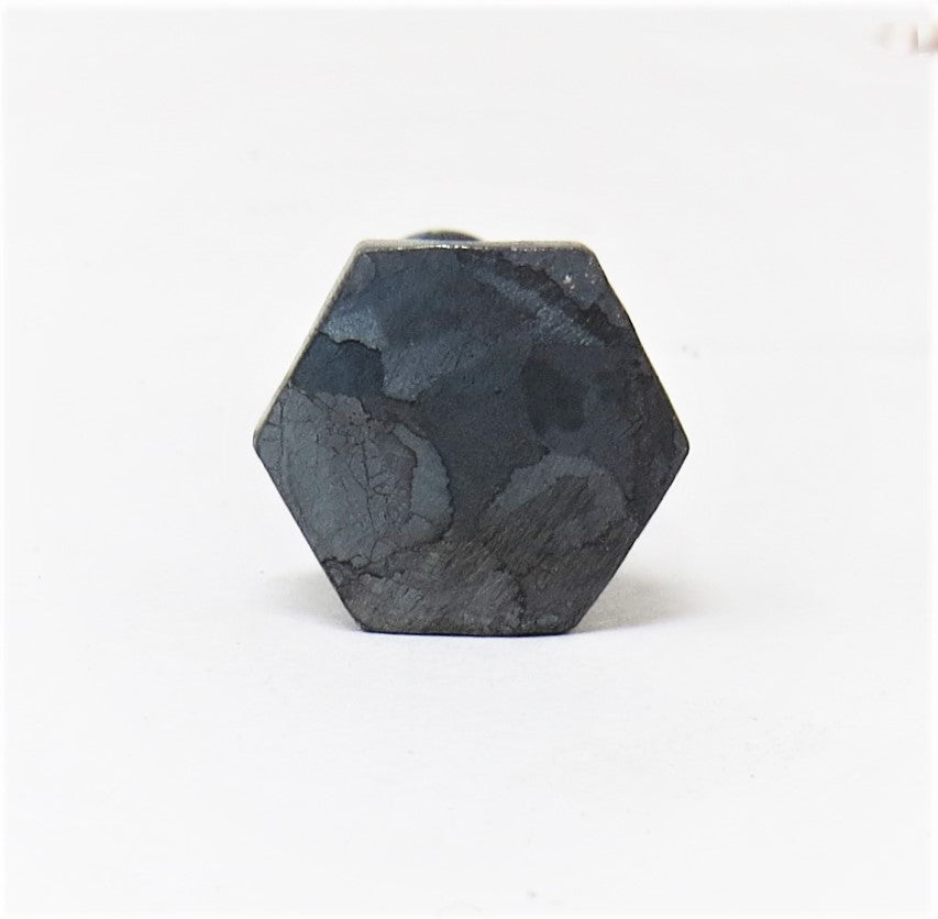 A black hammered hex head lag screw with a textured surface.