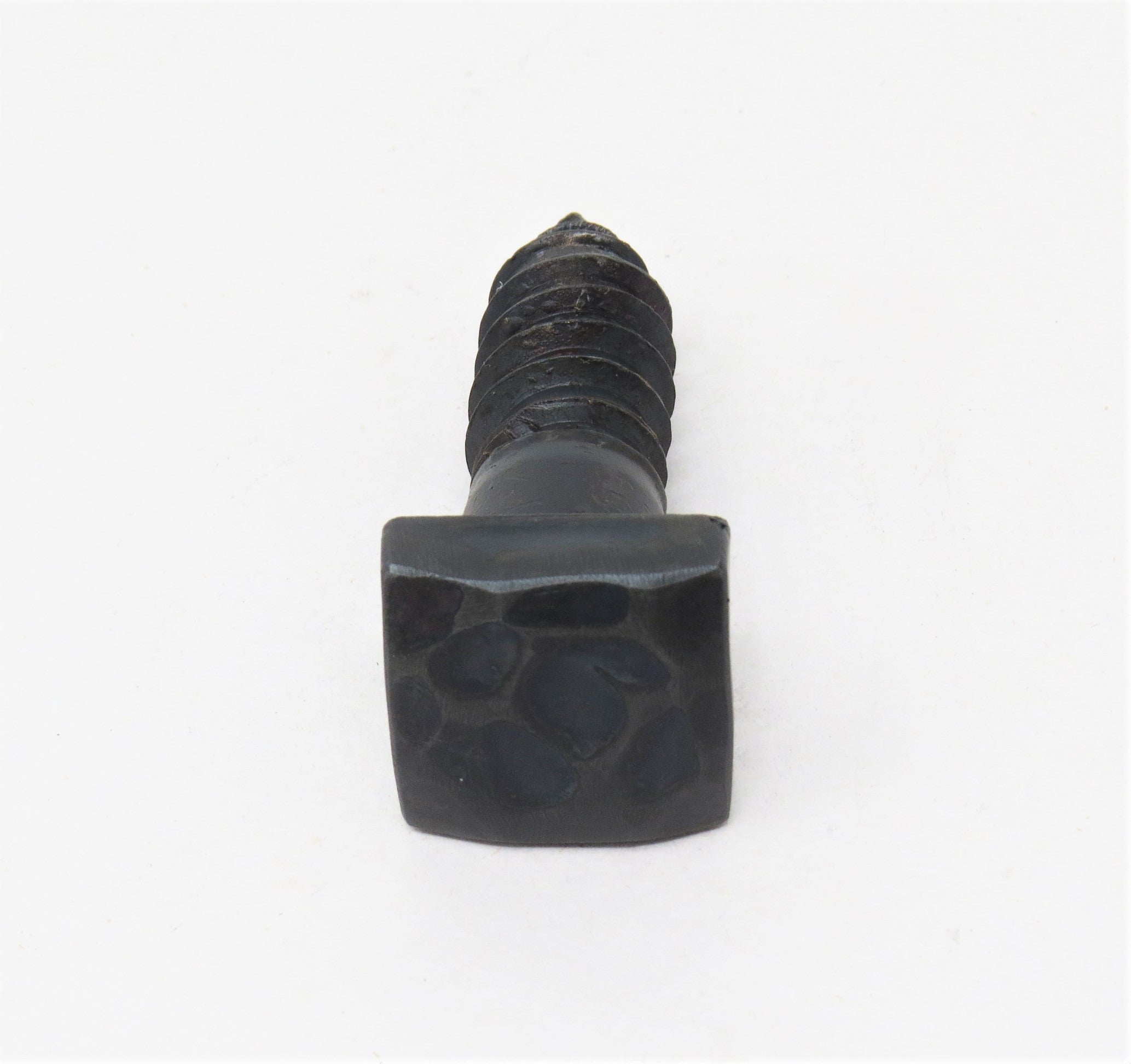 a side view of a hand hammered square head lag with a gun metal finish  with a white background